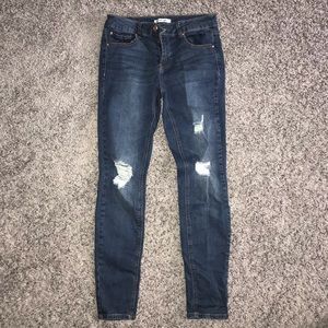 Skinny, ripped dark wash jeans